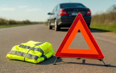 Essential Safety Kit: warning triangle and reflective jacket for any roadside stop.